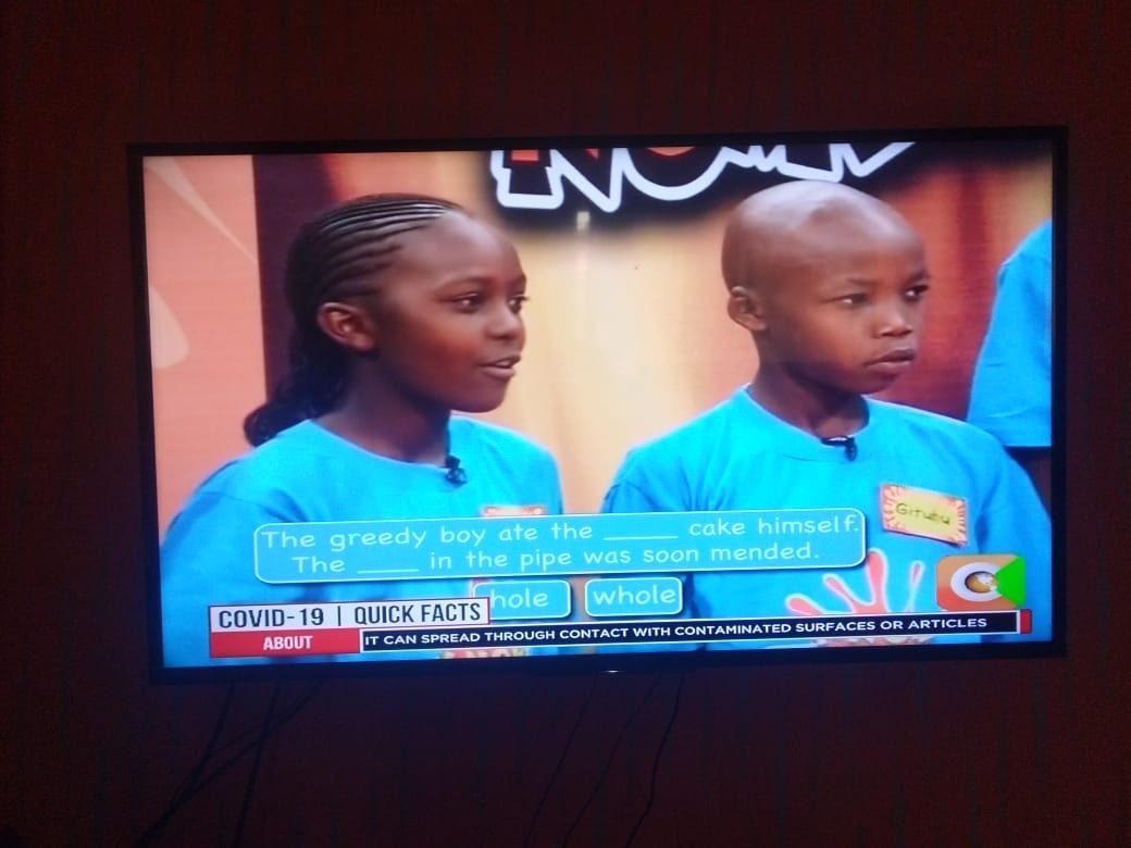 A young Njoki answering a language question on a televised maths and words competition.